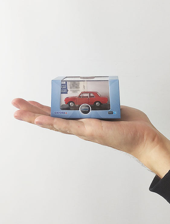 A 1:76 scale Ford Cortina Mk2 model car in red by Oxford.